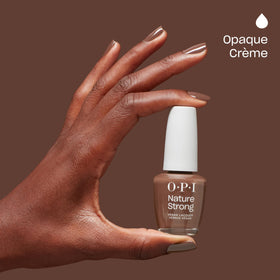 A hand holding OPI Nature Strong Nail Polish bottle