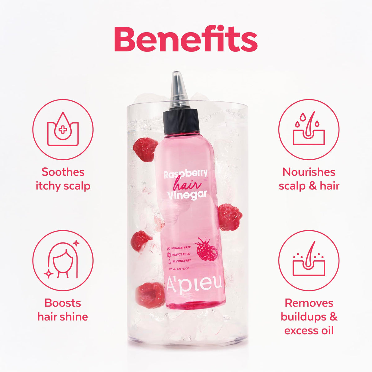 A'PIEU Raspberry Hair Vinegar bottle with a backdrop of hair care products