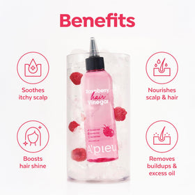 A'PIEU Raspberry Hair Vinegar bottle with a backdrop of hair care products