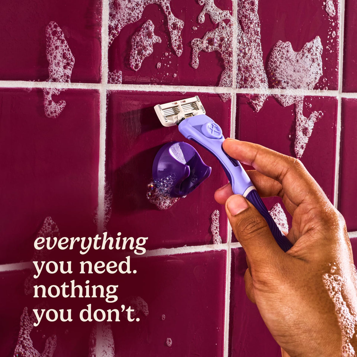Adhesive shower hanger for razor storage