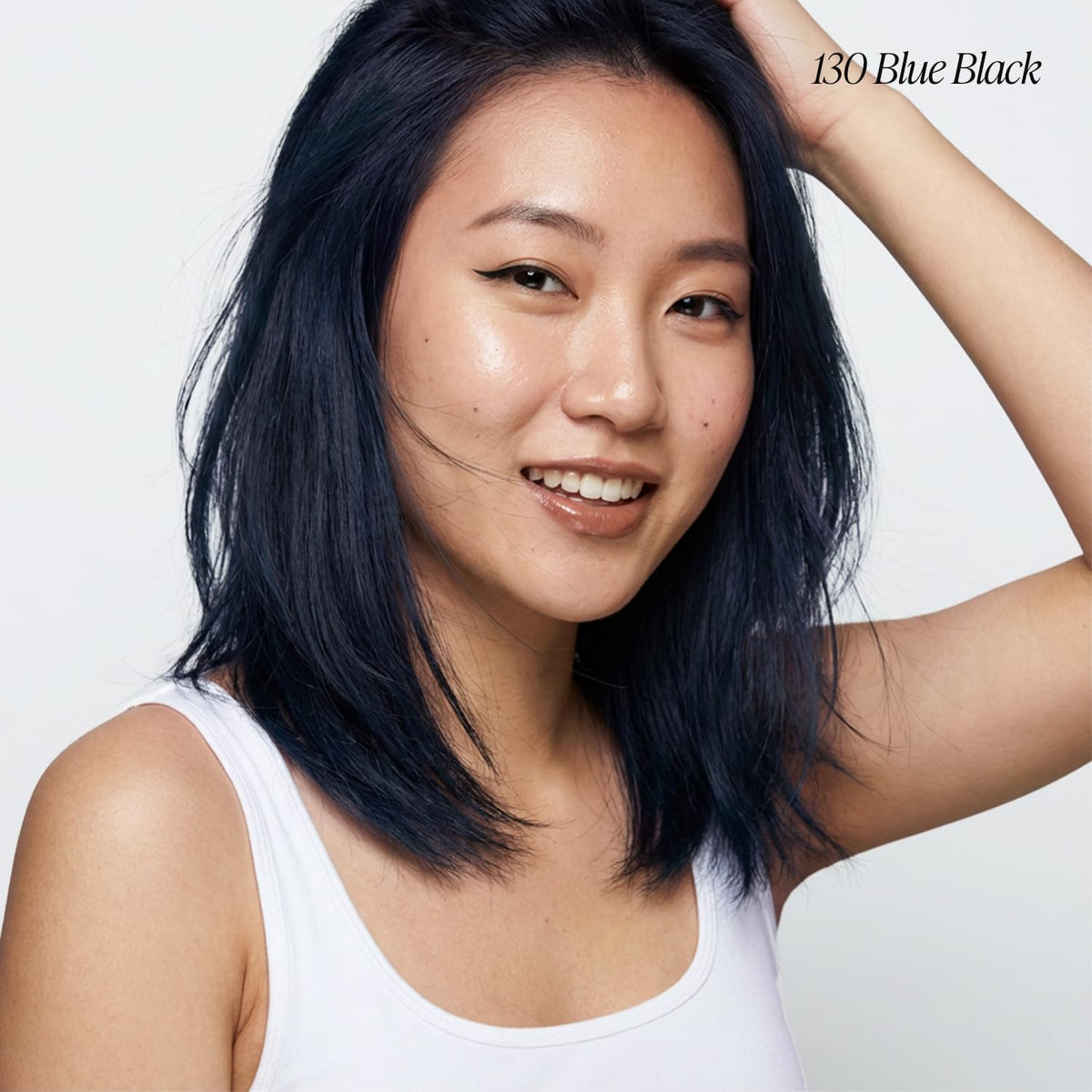Adore hair dye bottle showing vibrant blue black colour