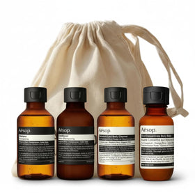 Aesop Arrival Travel Shower Set four-piece kit with reusable canvas bag