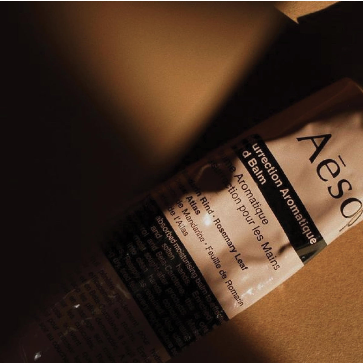 Aesop hand balm with a greaseless finish on hands