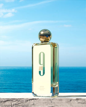 Afnan 9 AM Eau De Parfum bottle on a table