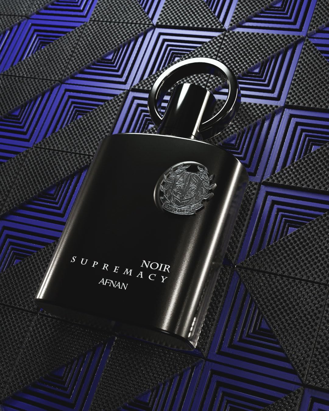 Afnan Supremacy Noir Eau de Parfum bottle with natural background