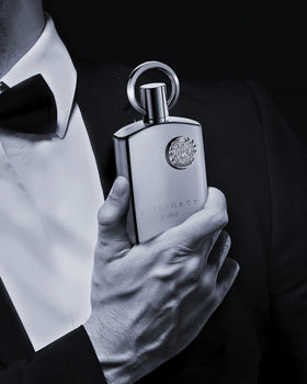 Afnan Supremacy Silver Eau de Parfum on a stylish table