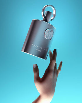 Afnan Supremacy Silver Eau de Parfum pouring onto a cloth