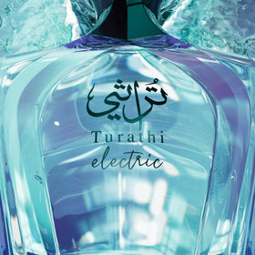 Afnan Turathi Electric Eau de Parfum displayed with citrus fruits