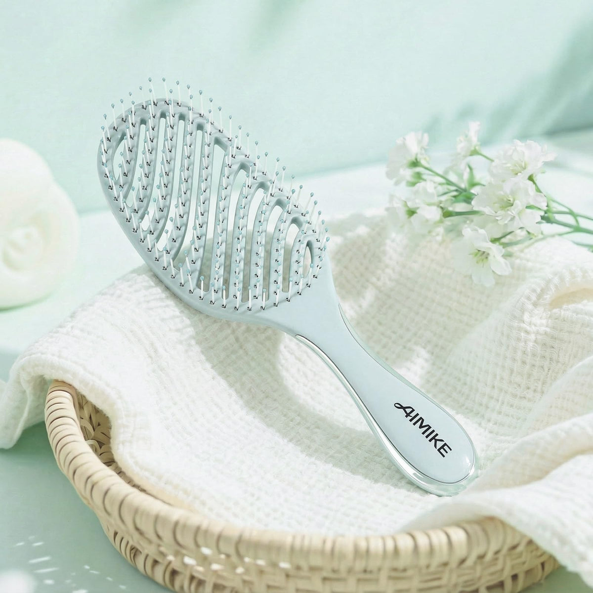 AIMIKE Detangler Hair Brush showing dual-sided electroplated handle