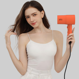 Aina Diffuser Hair Dryer in action styling hair