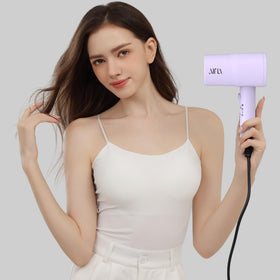 Aina Hair Dryer in use styling hair
