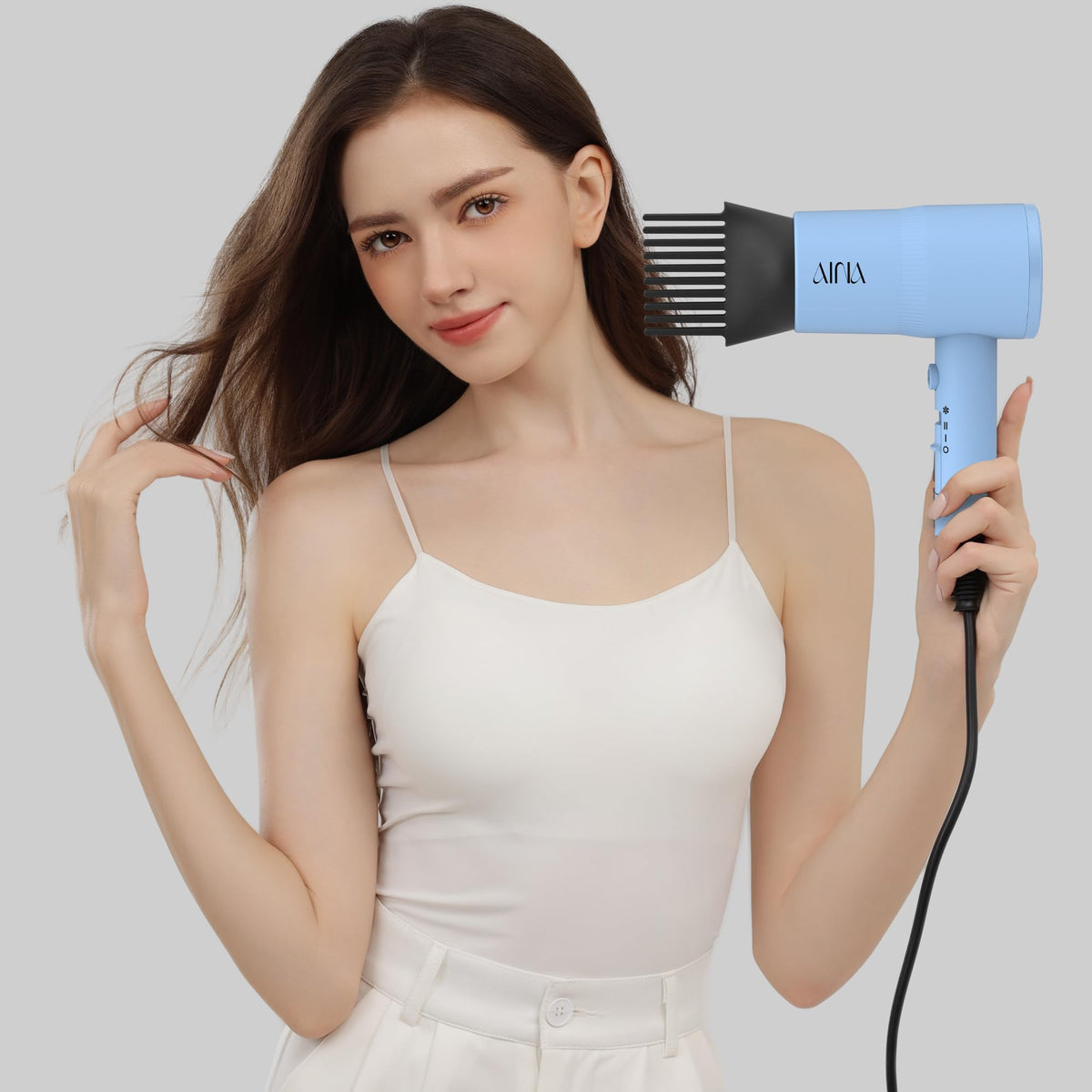 Aina Hair Dryer in use styling hair with diffuser