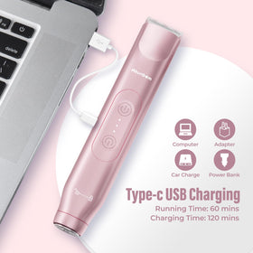 Akunbem Bikini Trimmer with accessories on a bathroom counter