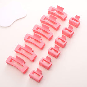 Alemaky large and small pink claw clips side by side