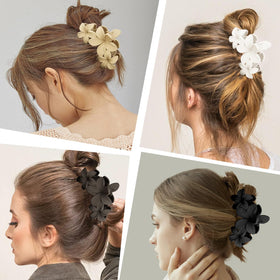 All 4 ANBALA Flower Hair Clips arranged together on a table