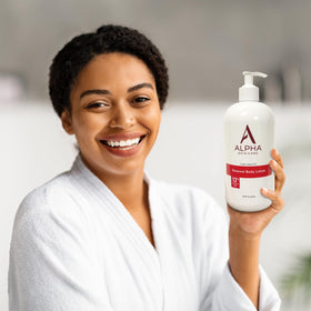 Alpha Revitalizing Body Lotion on a bathroom counter