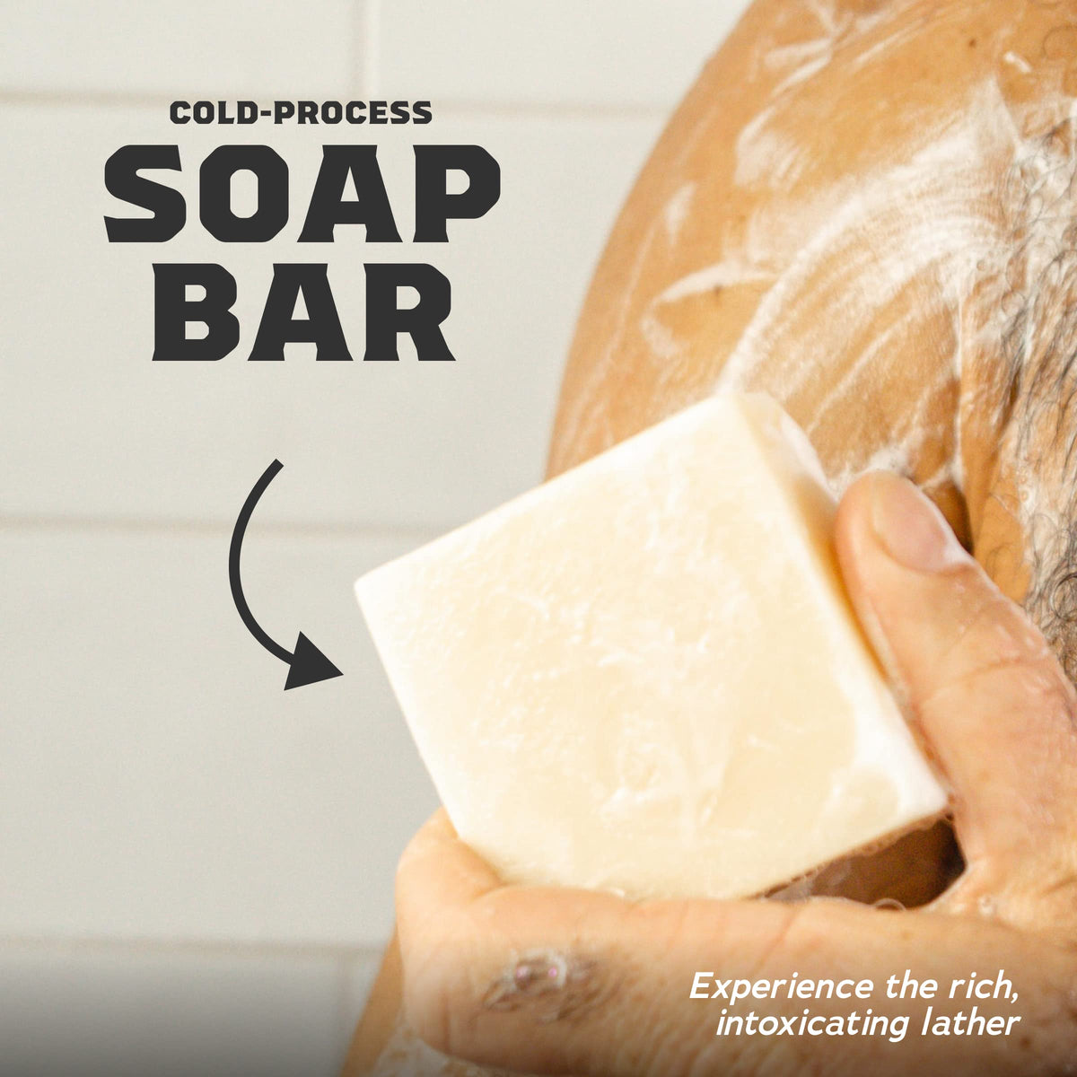 Alpine Sage bar soap from Dr. Squatch with fresh herbs in background
