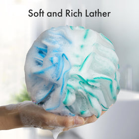 AmazerBath Charcoal Loofah Sponge in vibrant colours on a bathroom shelf