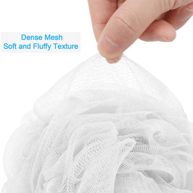 AmazerBath Loofah Sponge measuring 5.9 inches next to a standard sponge