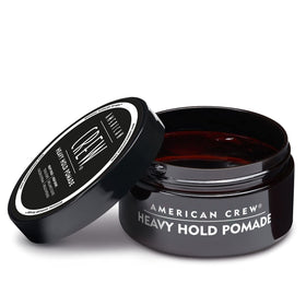 AMERICAN CREW Men's Hair Pomade Heavy Hold on a countertop