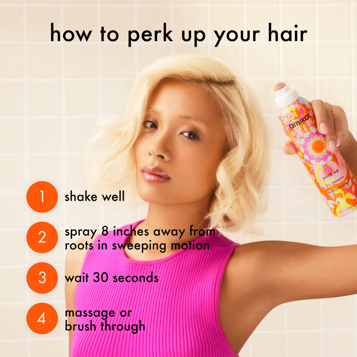 Amika Perk Up Dry Shampoo on a bathroom shelf