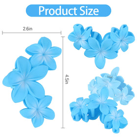 ANBALA flower hair clips displayed on a wooden surface