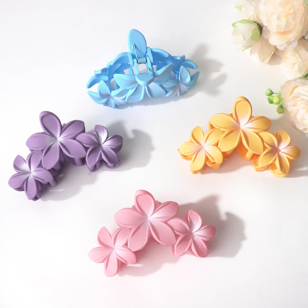 ANBALA Hawaiian Plumeria hair clips in use with long hair