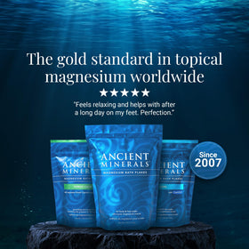 Ancient Minerals Magnesium Bath Flakes on a wooden surface