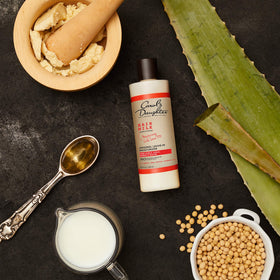 Application of Carol's Daughter Hair Milk on curly hair