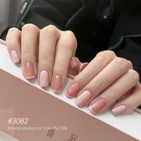 Application of GAOY gel polish on nails with UV lamp
