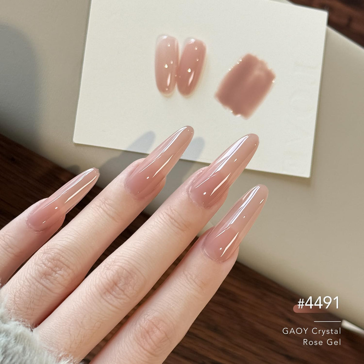Application of GAOY gel polish on nails with UV light