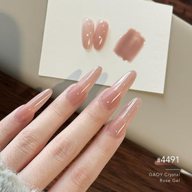 Application of GAOY gel polish on nails with UV light