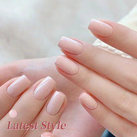 Application of pastel pink gel polish on nails