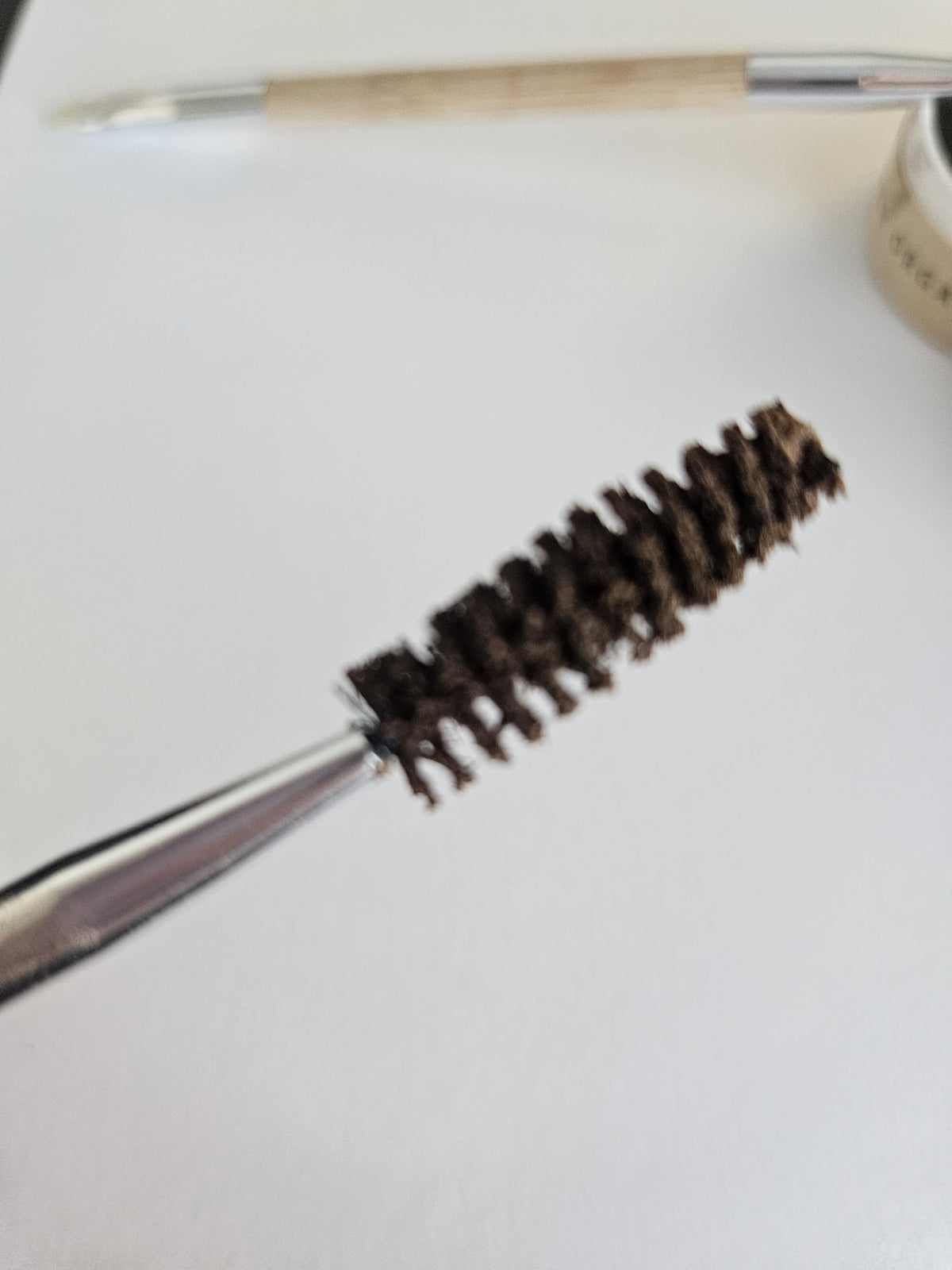 Application of River Organics Dark Brow Wax on brows