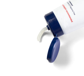 Aquaphor tube with cap open showing ointment