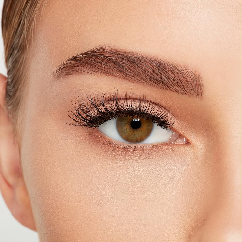 Ardell Naked Lashes 424 displayed with makeup tools