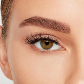 Ardell Naked Lashes 424 displayed with makeup tools