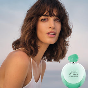 Armani Beauty Acqua di Gioia Eau de Parfum Intense bottle with floral background
