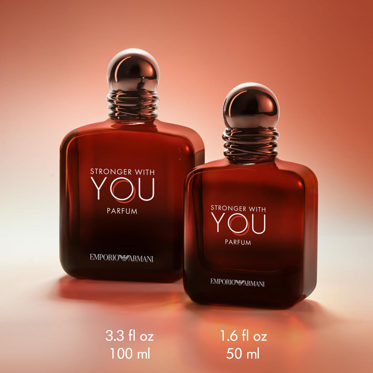 Armani Beauty Stronger With You Parfum bottle with chestnut and vanilla background