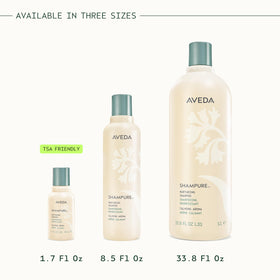 Aveda Shampure Nurturing Shampoo with floral background