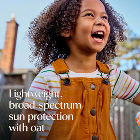 Aveeno Kids Sunscreen Lotion SPF 50 application on a child's arm