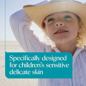Aveeno Kids Sunscreen Lotion SPF 50 in a beach setting