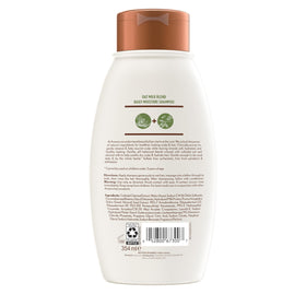 Aveeno Oat Milk Blend Shampoo with conditioner on a bathroom shelf