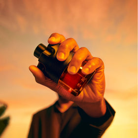Azzaro The Most Wanted Parfum displayed with a luxurious background