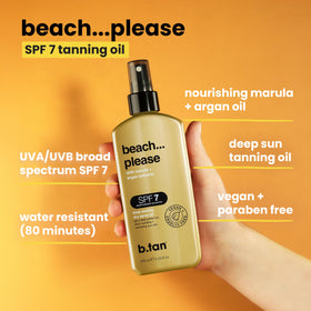 B.TAN Deep Tanning Oil Dry Spray on a beach towel