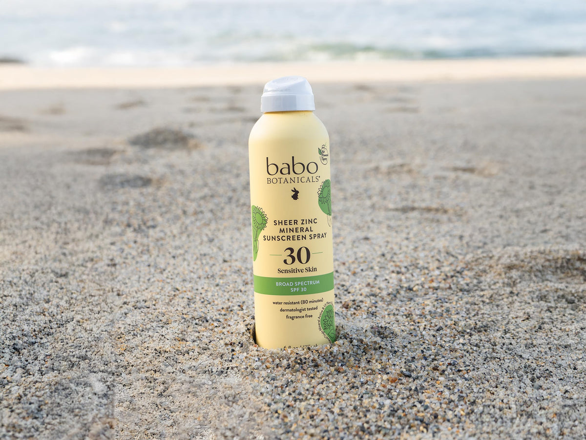 Babo Botanicals sunscreen spray bottle with plant background