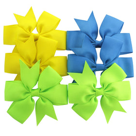 Babymatch hair bows in vibrant colours laid out