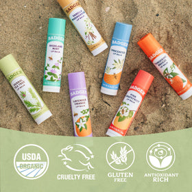 Badger Tea Tree Lip Balm with a natural background