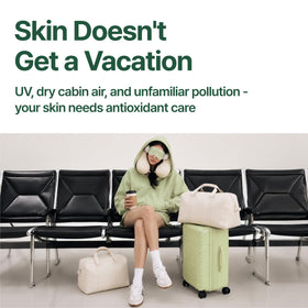 BANILA CO Clean It Zero Matcha Cleansing Balm Travel Kit displayed with travel essentials