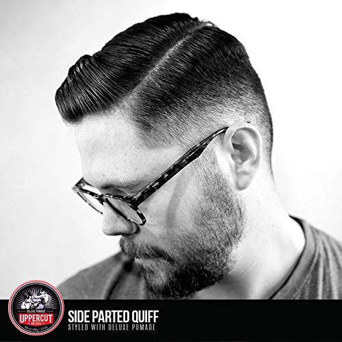 Barber using UPPERCUT DELUXE Pomade on client